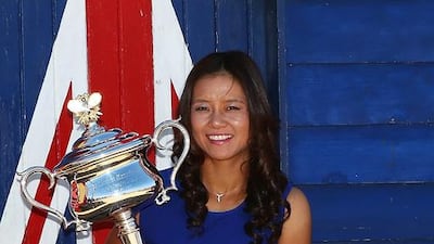 Li Na was all smiles posing with the Daphne Akhurst Memorial Cup at Brighton Beach, after winning the 2014 Australian Open. That quickly faded when she arrived back in China. Graham Denholm / Getty Images