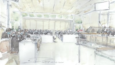 This court sketch made at the Paris courthouse shows the fourteen accused and their lawyers at the opening of the trial. AFP