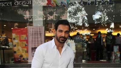 Actor and producer John Abraham looks sharp in a classic white shirt and jeans. Courtesy Instagram