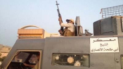 ISIL fighters parade in a stolen armoured vehicle belonging to Iraqi security forces in 2014. As the Iraqi army has cornered the group, ISIL fighters may seek to return to their countries of origin. AP Photo