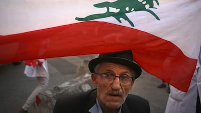 A Lebanese elderly man takes part in ongoing anti-government demonstrations in central Beirut on November 12, 2019. AFP