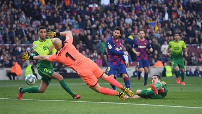Lionel Messi scores against Eibar at Camp Nou. AFP