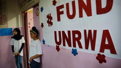 Palestinian refugee students stand outside a classroom as they wait to attend a ceremony to mark the return to school of a new year at one of the UNRWA schools in Beirut. AP Photo
