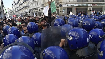 Algerian riot police block the progress of an anti-government demonstration heading towards the presidential palace in the capital Algiers, on February 22, 2020. AFP