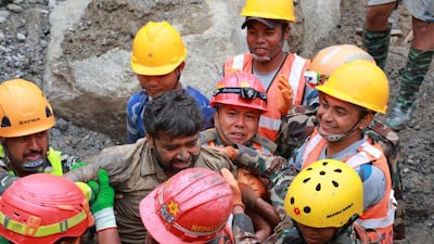 A worker rescued from a hydropower tunnel in the flood-hit Rasuwa district of Nepal. EPA