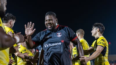 Moeneeb Galant of Dubai Exiles celebrates the win.