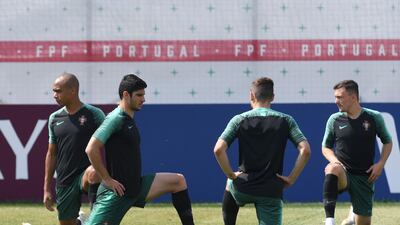 Portugal's midfielder Joao Mario, forward Goncalo Guedes, midfielder Adrien Silva and defender Rui Mario take part in a training session. Francisco Leong / AFP