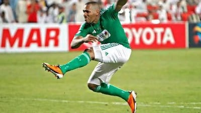 Al Ahli’s Victor Simoes scores the winning penalty against Al Jazira.
