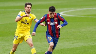 Barcelona's Pedri under pressure from Ruben Sobrino of Cadiz. Reuters