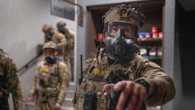 Federal agents break up an anti-ICE protest outside a Minneapolis hotel on January 25. Getty Images / AFP
