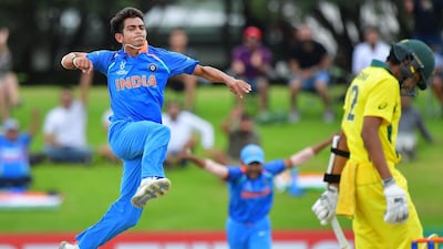 India's Kamlesh Nagarkoti, left, celebrates Australia captain Jason Sangha, right, being caught in the final. Marty Melville / AFP