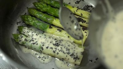 5. Put the asparagus in a clean saucepan, spoon over the butter sauce and place on the stove to warm through. Turn the asparagus over to coat it with sauce on both sides.