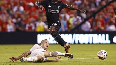 Liverpool midfielder Sadio Mane, right, avoids the slide of AS Roma midfielder Radja Nainggolan during the first half of a friendly match, Monday, August 1, 2016, in St Louis. Billy Hurst / AP Photo