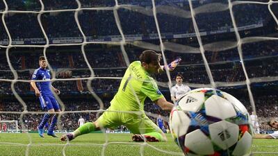 Real Madrid goalkeeper Iker Casillas misses stopping Schalke's first goal to go 1-0 up, scored by Christian Fuchs, on Tuesday in their Champions League match. Gerard Julien / AFP