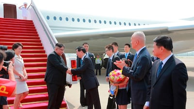 The North Korean leader was greeted by Wang Huning, member of the Politburo Standing Committee, on arrival at Beijing Capital International Airport in Beijing. KCNA / AP Photo