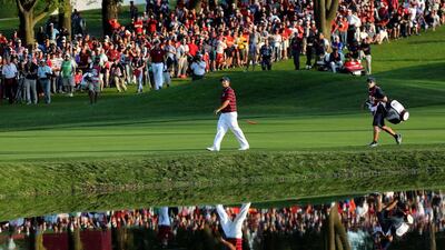 Patrick Reed of the United States walks up the 16th hole during afternoon fourball matches. David Cannon / Getty Images