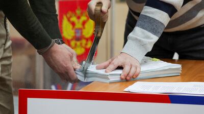 Electoral commission members destroy unused ballot papers in St Petersburg. Reuters
