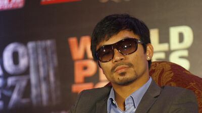 Manny Pacquiao insists he is waitjing on Floyd Mayweather and his camp to agree their side of the deal. Mike Young / The National