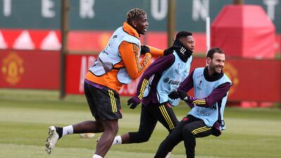 Paul Pogba, Juan Mata of Manchester United in action. Getty