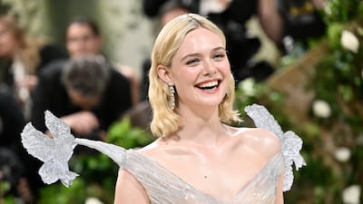 Elle Fanning in Cartier jewellery and a resin dress by Balmain. AP