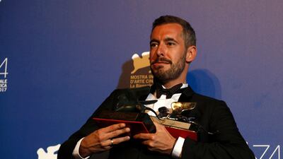 Director Xavier Legrand with the Venezia Prize Luigi De Laurentiis Lion of The Future and Silver Lion for best director awards for Jusqu' a la garde or Custody during the awards photo call at the 74th Venice Film Festival. Domenico Stinellis / AP photo