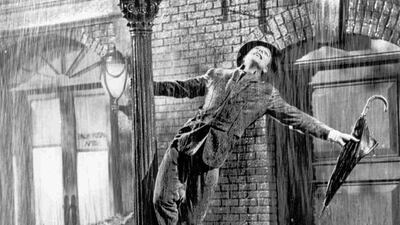 Gene Kelly performs in the 1952 film Singin’ in the Rain. AP