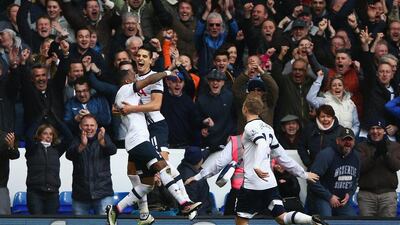 Erik Lamela of Tottenham Hotspur celebrates with Danny Rose and Christian Eriksen as he scores their third goal during the Premier League match between Tottenham Hotspur and Manchester United at White Hart Lane on April 10, 2016 in London, England. (Photo by Ian Walton/Getty Images)