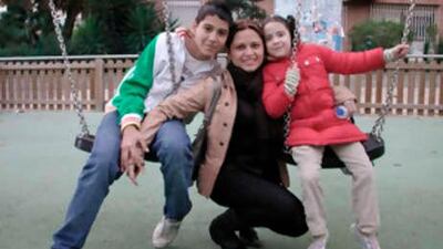 Claudia Castillo, 30, poses with her children. Ms Castillo is the recipient of a windpipe transplant which used tissue grown from her own stem cells, in Barcelona, Spain.