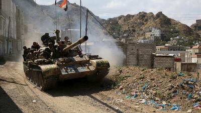 Soldiers loyal to Yemen’s government ride atop a tank in the country’s southwestern city of Taez on December 16, 2015. Reuters