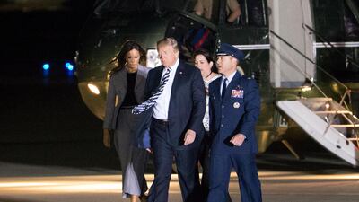 US President Donald Trump (C) and First Lady Melania Trump (L) arrive at Joint Base Andrews to greet three US detainees that were released by North Korea, in Maryland. Michael Reynolds / EPA