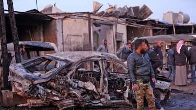Destroyed vehicles following a car bomb attack at a local market in the Turkish-held Syrian Kurdish town of Tel Hal along the border with Turkey in the northeastern Hassakeh province. AFP