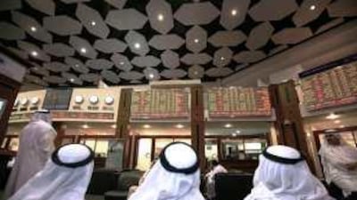 Traders on the floor of the Dubai Financial Market stock exchange.