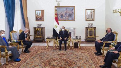 Egyptian President Abdel Fattah El Sisi, centre, meets Mr Lapid. EPA