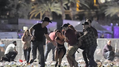 Festival goers run for their lives. David Becker / Getty Images
