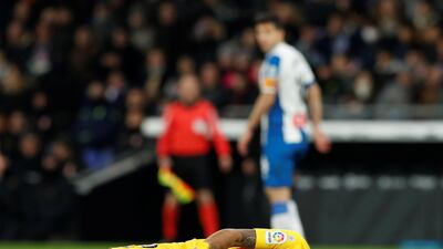 Barcelona's Luis Suarez reacts after sustaining an injury. Reuters
