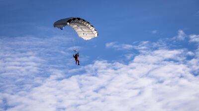 Swiss adventurer Raphael Domjan floats though the sky after jumping from the SolarStratos solar powered aircraft prototype with Spanish test pilot Miguel A Iturmendi aboard during an attempt to break two world records at an airbase in Payerne, Switzerland. EPA