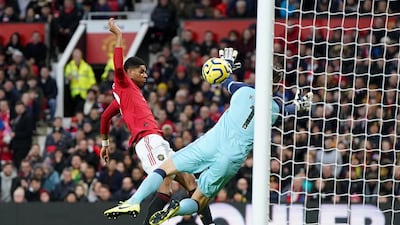 Manchester United's Marcus Rashford scores his team's first goal against Norwich City at Old Trafford. Reuters