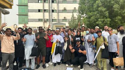 Workers and volunteers pose for a group photo