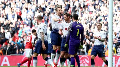 Hugo Lloris of Tottenham Hotspur celebrates with teammates after saving a penalty. Getty Images