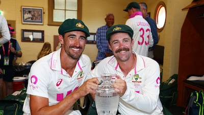 Mitchell Starc, left, and Travis Head pose with the Ashes. The Australians were the dominant figures with bat and ball throughout the five-match series. Getty Images