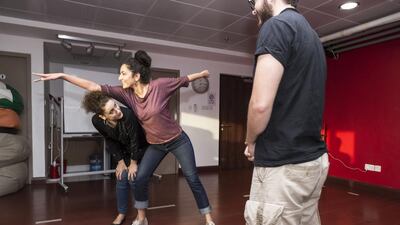 From left, Mina Liccione, Dana Dajani and Ahmad Molham Makki, cast members of Invisible Cities: Words and Rhythms About a Place Called Home. Antonie Robertson / The National
