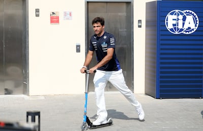 Williams driver Carlos Sainz Jr of Spain rides his scooter at the paddock ahead of the Formula One Abu Dhabi Grand Prix. EPA