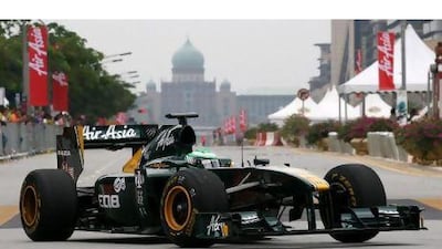Heikki Kovalainen, the Team Lotus driver, has a strong relationship with Fernandes, the Formula One team's owner. Lai Seng Sin / AP Photo