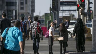 Walkers experience a very different experience of Abu Dhabi compared to those using motorised transport. Silvia Razgova / The National