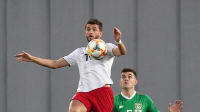 Georgia's Giorgi Kvilitaia, left, with John Egan of Ireland. Reuters