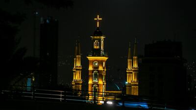 The full moon is seen in the sky over Al-Ameen Mosque and St. Gregory church, Beirut, Lebanon. Nbail Mounzer / EPA
