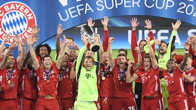 Goalkeeper and captain of Bayern Munich Manuel Neuer lifts the trophy after the team won the Uefa Super Cup final against Sevilla at the Puskas Arena in Budapest, Hungary. EPA