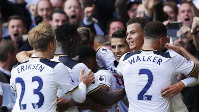 Dele Alli, second right, celebrates with teammates after scoring the second goal in Tottenham's 2-0 win over Manchester City. Eddie Keogh / Reuters