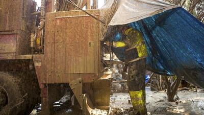 Driller Justin Arney of Diamond Well Drillers drills to deepen the Brady family well. Max Whittaker / Reuters