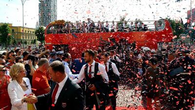 Albanian team officials and players shake hands with fans after the soccer squad returned from the European Championship, in Tirana, Thursday, June 23, 2016. Hektor Pustina / AP Photo